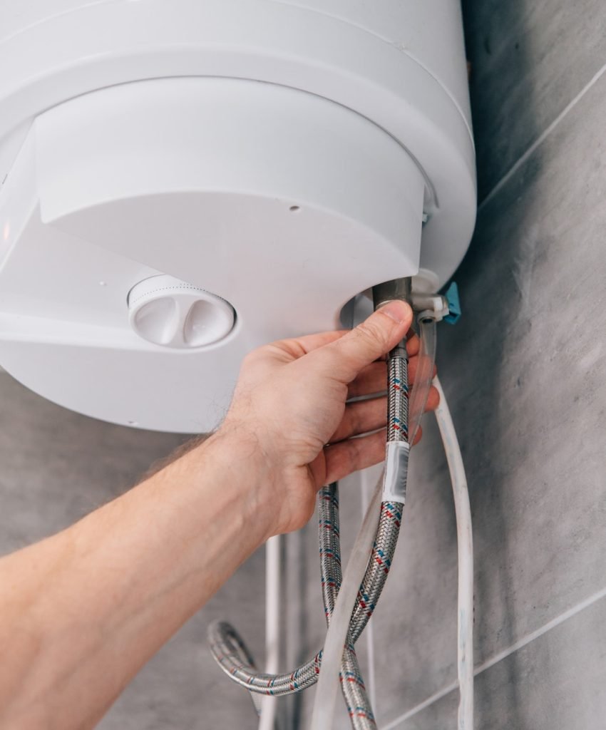 cropped-shot-of-male-plumber-repairing-electric-boiler-in-bathroom.jpg